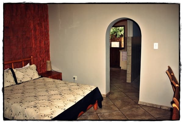 Warmly furnished room at Safari Travelodge