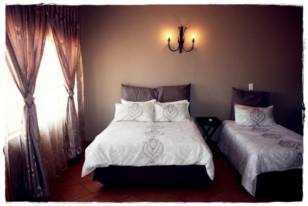 Family room with a double bed and single bed